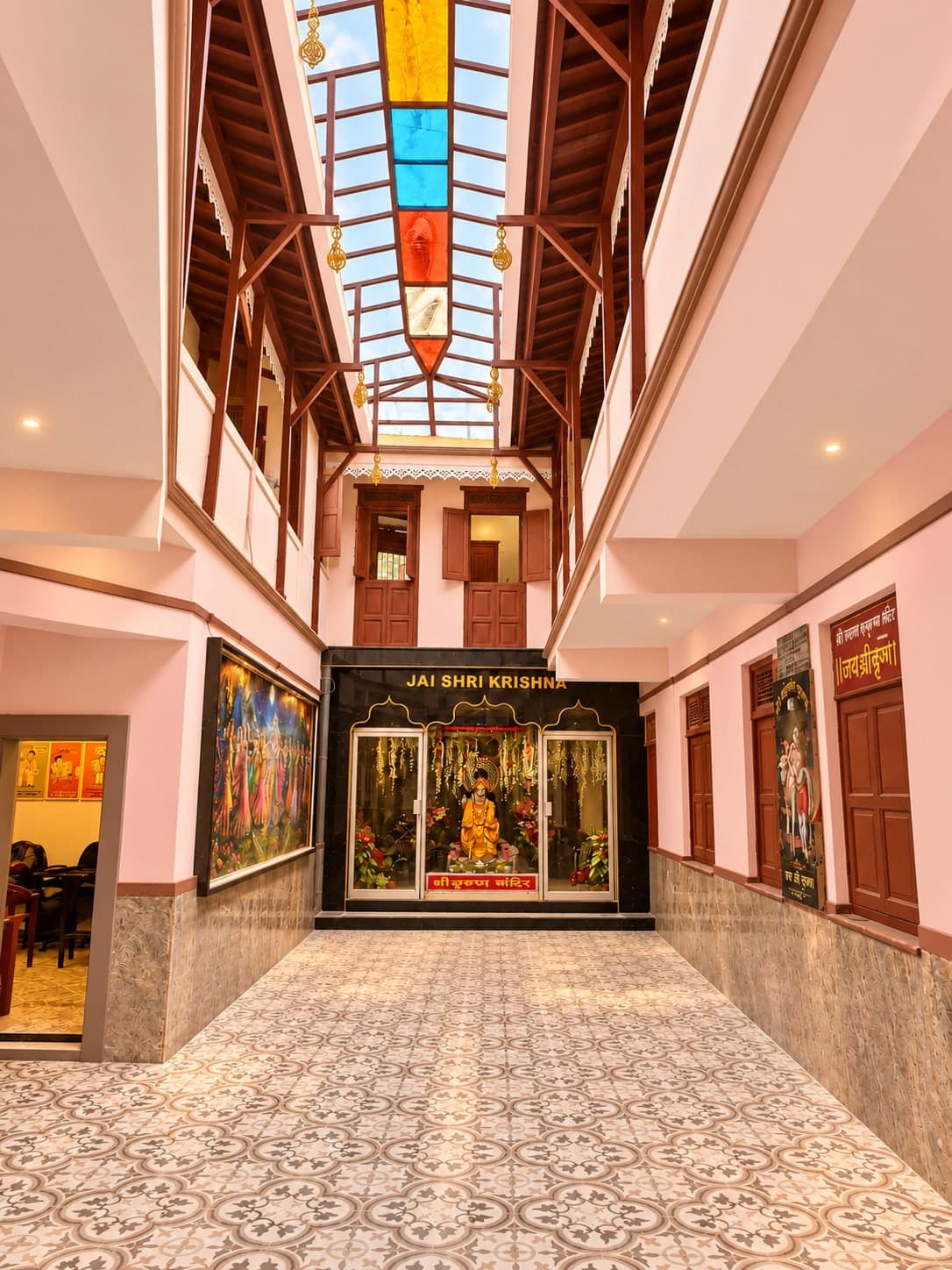 Inner courtyard with a coloured-glass skylight, wooden galleries and Shree Gopal Krishna Mandir at the far end